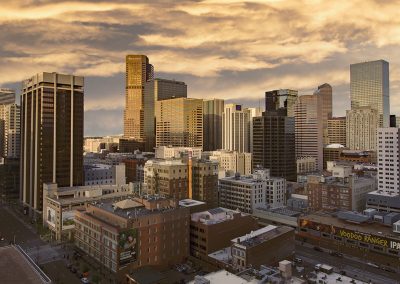 Downtown Denver skyline under cloudy sky