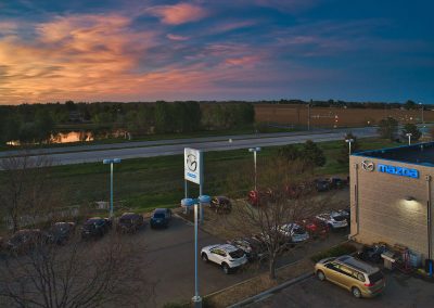 Mazda dealership with sunset background