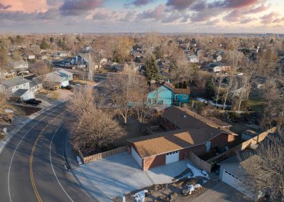 Aerial view of suburban neighborhood during sunset